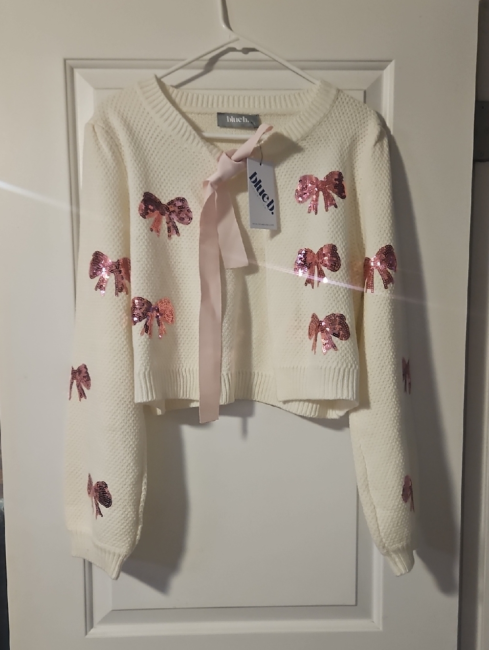 Cropped Cream Cardigan with Pink Sequin Bow Accents